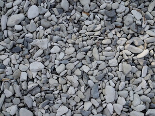 abstract background with round peeble stones on sunny day