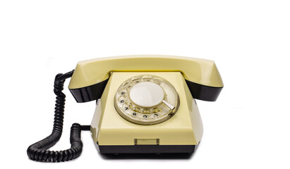 Yellow vintage phone on a white background.