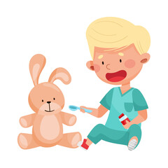 Obraz na płótnie Canvas Careful Little Boy in Medical Wear Treating Toy Hare Vector Illustration