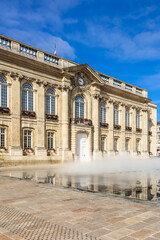 Fototapeta na wymiar Fountain and City Hall building in the center city. Beauvais, France