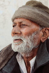 Closeup portrait of an old Indian man looking sideways