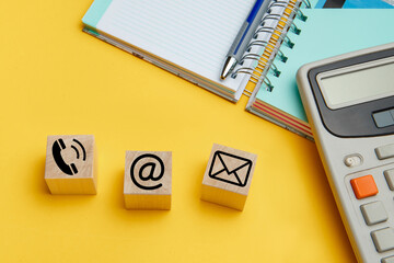 Website and Internet contact icons on wooden cubes
