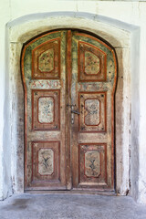 Old vintage door with painted flowers motifs from 1792.