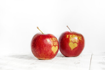 St. Valentine's Day. Two apples with the inscription I love you on a white background close-up.