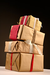 a stack of holiday gifts, side view