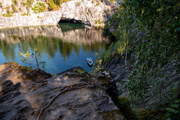mountain lake with clear green water in granite and marble rocks in a natural monument