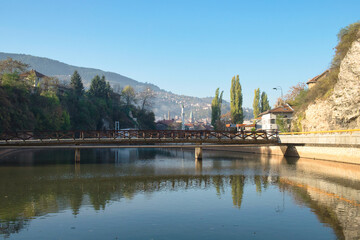 Fototapeta premium Sunny autumn morning on Miljacka river in Sarajevo, Bosnia and Herzegovina