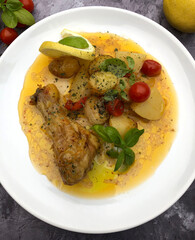 Crispy, tender oven roasted chicken with potatoes and cherry tomatoes. One pan weeknight meal.