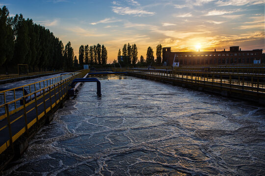 Modern wastewater treatment plant. Tanks for aeration and biological purification of sewage at sunset