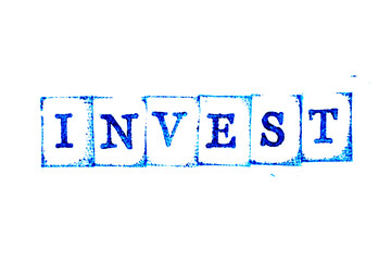 Blue color ink of rubber stamp in word invest on white paper background