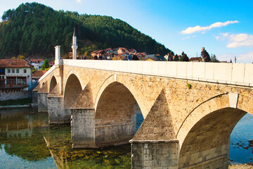 Fototapeta premium The old Ottoman town of Konjic, Bosnia and Herzegovina, is famous for medieval stone bridge across Neretva river 