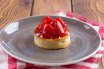 Mini tart with strawberries close up. Berry dessert