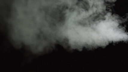 White water vapour on a black background. Close-up shot. White Fume Slowly Floating Rises Up. Abstract Haze Cloud. Animation Mist Effect. Smoke Stream Effect 4K