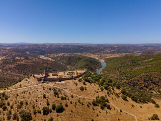 Noudar medieval castle aerial view, with Alentejo landscape background. Located 5 kilometres from the Spanish border. Alentejo, Portugal.