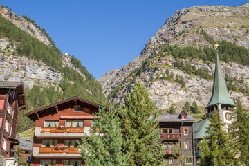 Houses and church at Zermatt, Valais canton, Switzerland (summer, blue sky)