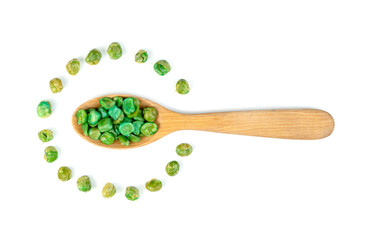 Green peas roasted in wooden spoon isolated on white background