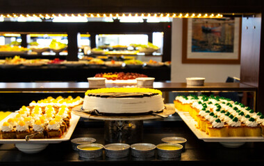 Oriental sweets in a wide range, cakes, baklava, Turkish delight with almonds, cashews and pistachios on plates