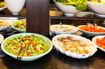 Catering food, salad in a white plate, buffet