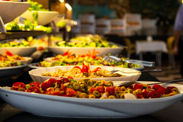 Catering food, salad in a white plate, buffet