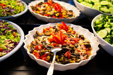 Catering food, salad in a white plate, buffet
