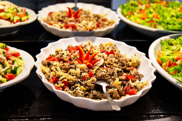 Catering food, salad in a white plate, buffet
