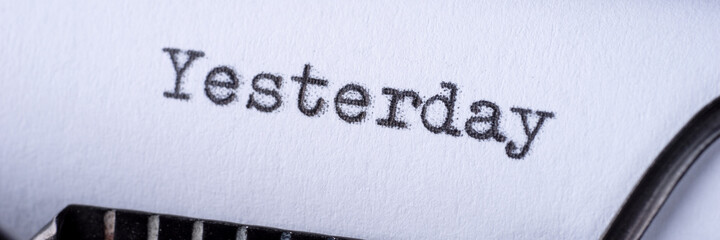 Yesterday - word typed on a vintage typewriter. Panoramic image