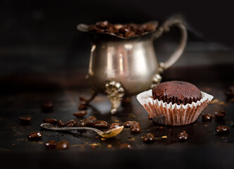 tasty chocolate brownie cupcake on dark background