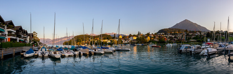 Fototapeta na wymiar Harbor of Spiez, lake Thun, Switzerland, with boats (Panoramic view)