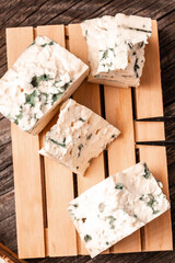 blue cheese dor blue on wooden background, recipe top view