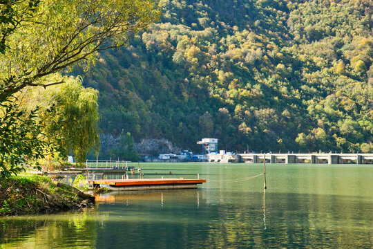 An old fishing boat on the tranquil surface of Drina river on the border between Serbia and Bosnia and Herzegovina