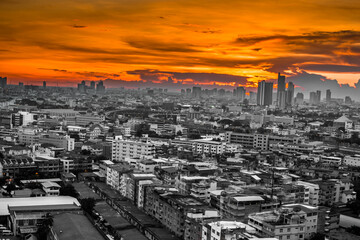 The high angle background of the city view with the secret light of the evening, blurring of night lights, showing the distribution of condominiums, dense homes in the capital community