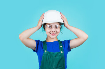 Visiting Construction Site. childhood and education concept. baby building. cute kid putting on construction helmet. childhood happiness concept. Little happy girl engineer