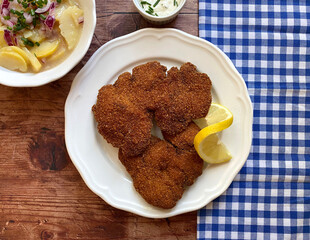 Classic dish, deep fried chicken livers with potato salad and sauce tartare. The potato salad is served with red onions and chives.