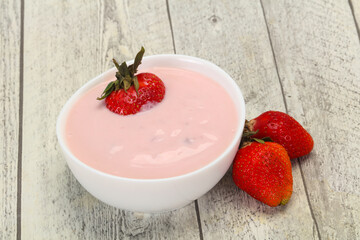 Yoghurt with strawberry in the bowl