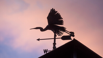 Weathervane sculpture of a great blue heron on a home in St. Mary's County, Maryland.