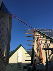 Fototapeta na wymiar solar panel installation on the roof. Man guy install solar panels