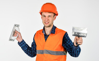 transfer of experience. young worker is engineer assistant. repairman in uniform. man use spatula...