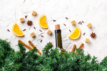 Obraz na płótnie Canvas Bottle of wine, orange, sugar, cinnamon sticks, anise and fir branches