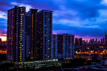 Fototapeta na wymiar panoramic high-angle evening background of the city view,with natural beauty and blurred sunsets in the evening and the wind blowing all the time,showing the distribution of city center accommodation