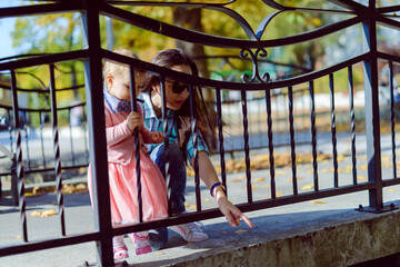 Obraz na płótnie Canvas Adorable girl having fun on beautiful autumn day. authentic childhood image.