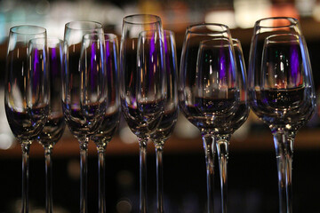 Long crystal glasses in a bar within a bar