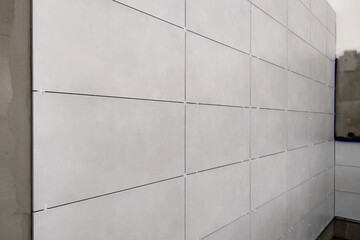 Wall ceramic tiles installation on mortar glue.