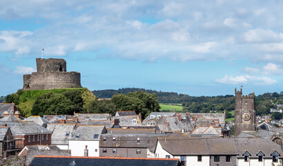 View over rooftops showing Parish Church and Castle, Launceston, Cornwall, UK.