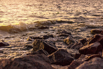 Rocky coast of the Gulf of Finland at sunset. Romantic evening. Summer