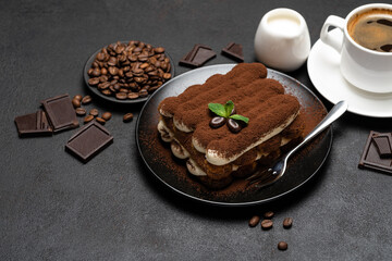 Classic tiramisu dessert, cup of coffee, sugar and milk on concrete background