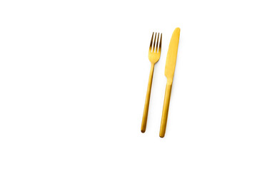 Top view with golden cutlery isolated on white background