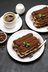 Classic tiramisu dessert, cup of coffee, sugar and milk on concrete background