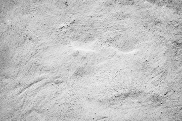 Texture of a concrete wall with cracks and scratches which can be used as a background