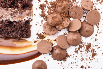 Delicious cream-caramel dessert with peanuts on a white background