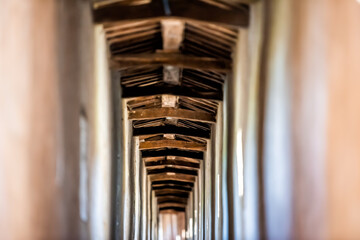 Lion fortress tunnel empty path passage way in rocca del leone Castiglione del Lago in Italy with windows and shadows in historic town village fort